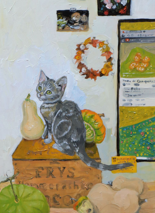 Painting of a silver tabby kitten with various pumpkins. The kitten is sitting on an old wooden box that reads 'Frys homoepathic cocoa'.  There's postcards of old still life on the wall, and a monitor to the right with a recipe for Chouquettes on screen.