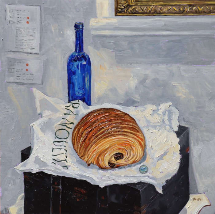 Thick impressionist realistic painting of a pain au chocolat on a white bakery bag that reads 'Franquette'. It sits atop a black wooden box with rusty fixings. Behind it sits a blue bottle. On the white walls in the background you can see a peep of golden frame, along with some gallery placards with red dots.
