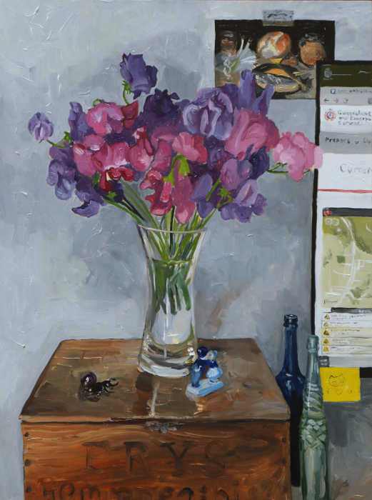 Painting of a glass vase full of pink and purple sweet peas. It's sitting atop an old wooden box that reads 'Frys homoepathic cocoa'. Next to it on the box is a stag beetle, marble, and a dutch blue kissing sculpture. Next to it are 2 bottles, one blue, one green, and part of a computer screen that shows the QFES website showing Long Road. Behind this is a postcard on the wall of Georg Flegel's still life with a stag beetle.